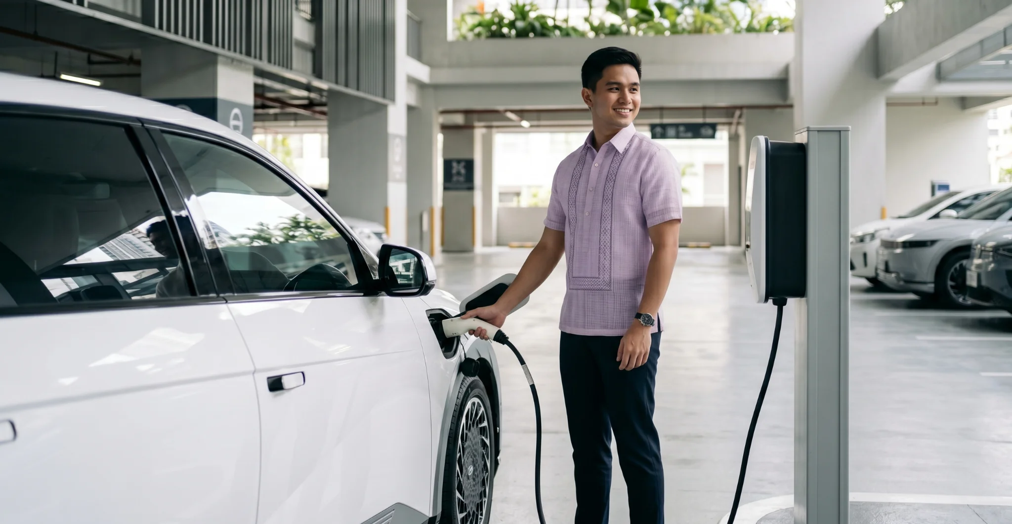 Charging an EV at a modern parking facility in the Philippines