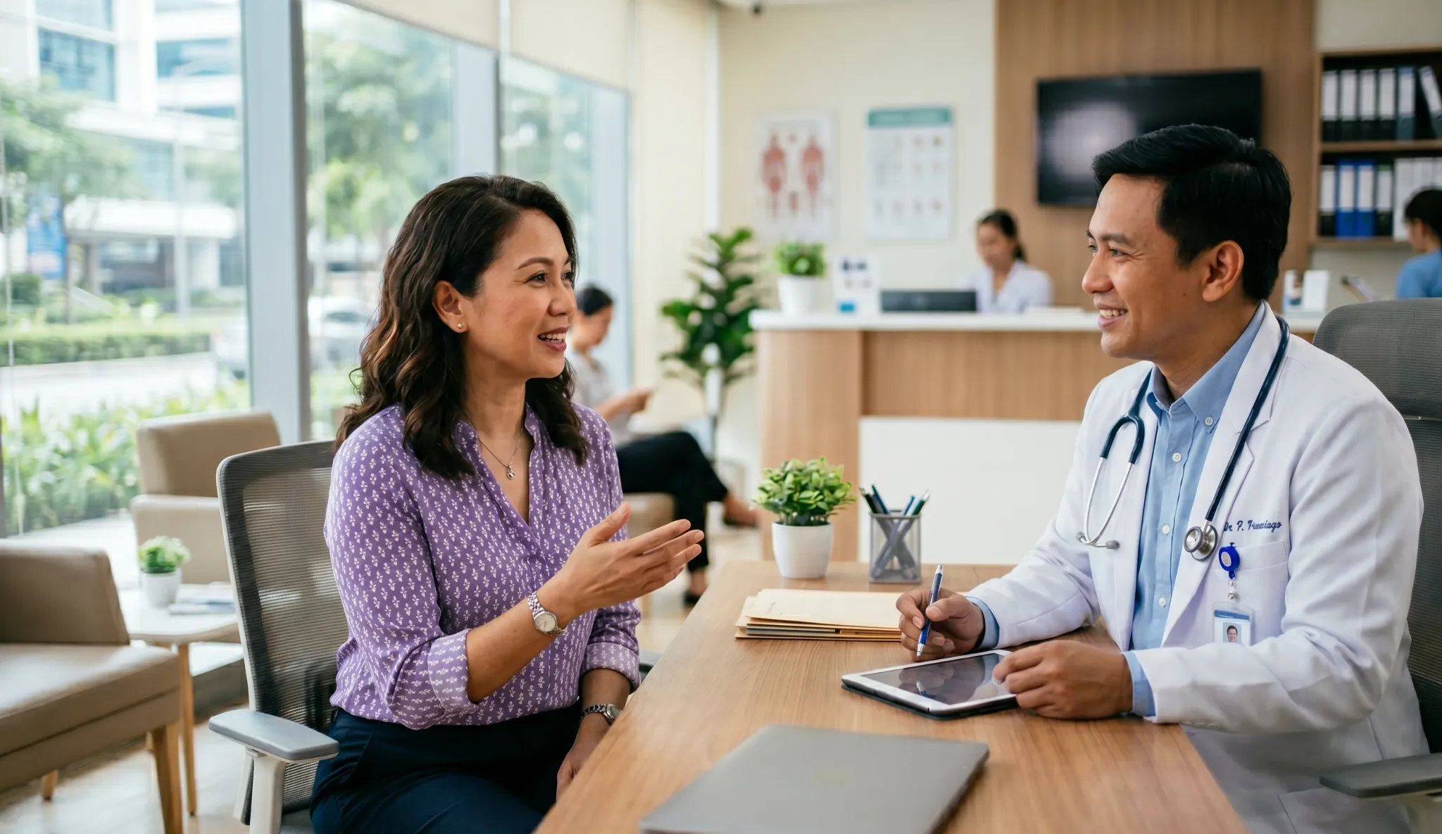 Filipino patient consulting with doctor at private hospital