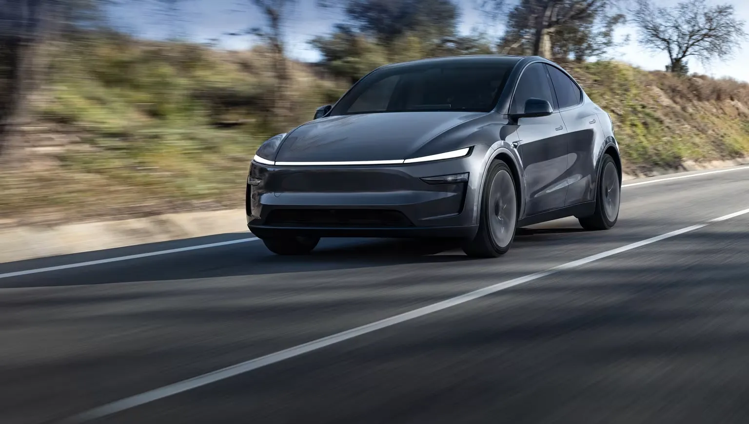 Tesla Model Y driving on a highway