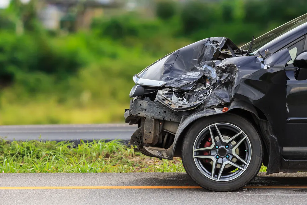 Damaged car being inspected for total loss insurance claim
